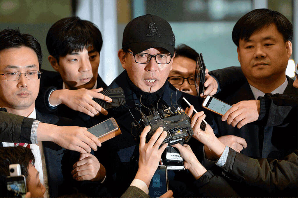 South Korean artistic director Cha Eun Taek responding to reporters’ questions as he arrives at Incheon International Airport in South Korea on Nov 8, 2016.
