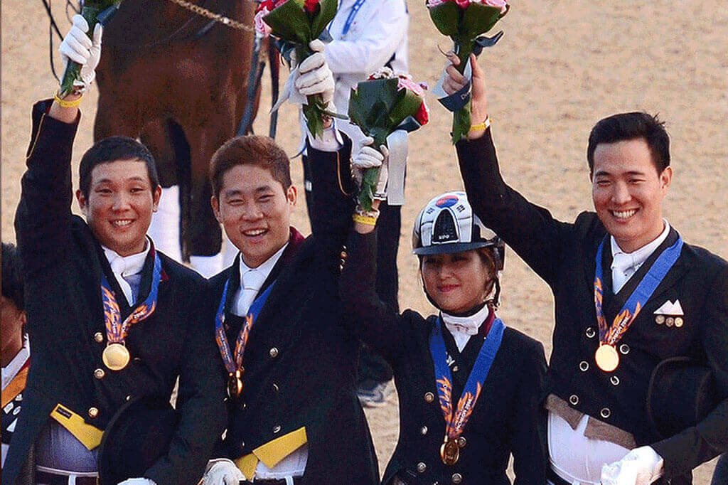 Ms Chung (second from right) and her teammates receiving gold medals at the 17th Asian Games in Incheon, South Korea, in 2014.