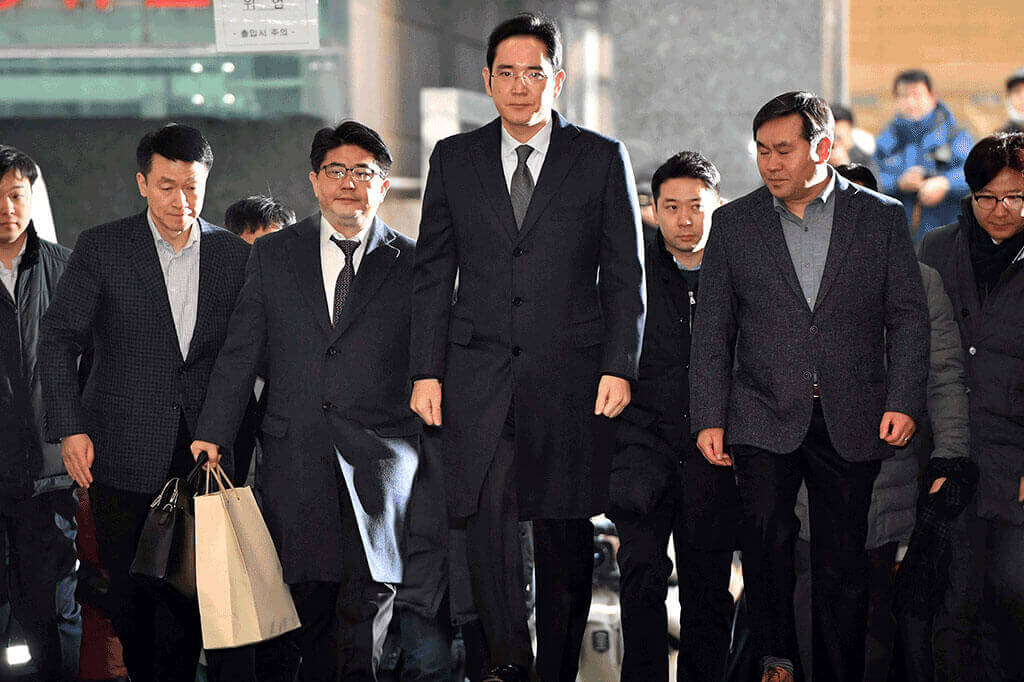 Lee Jae Yong (centre) arriving at the office of the independent counsel in Seoul, South Korea, to be questioned on Feb 13, 2017.