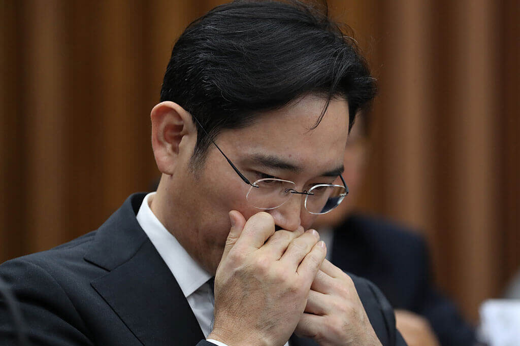 Mr Lee applies lip balm during a parliamentary hearing at the National Assembly in Seoul, South Korea, on Dec 6, 2017.