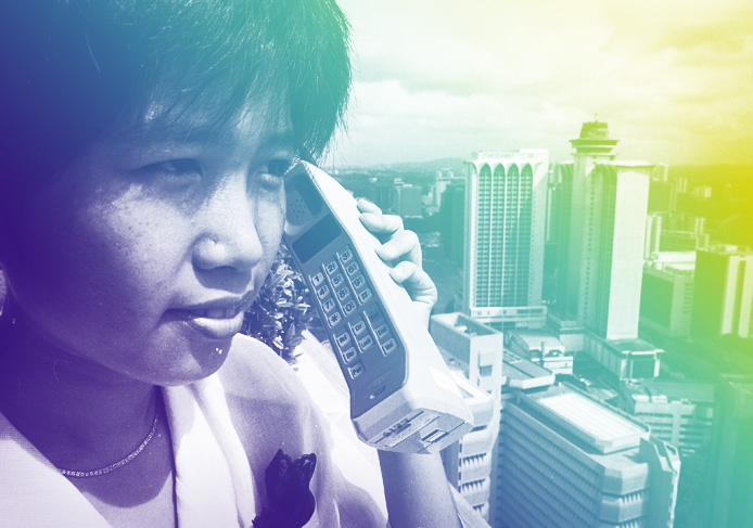 The handphone fits snugly in the palm of Telecoms officer Yen Ee Wen executive